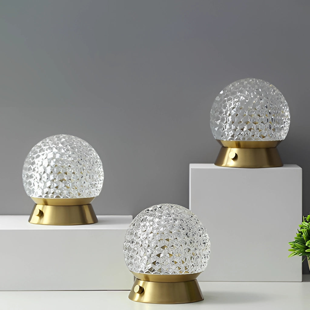 Modern design cordless rechargeable table lamp LED dimmable light, featuring yellow and silver colors, accompanied by plant decoration.