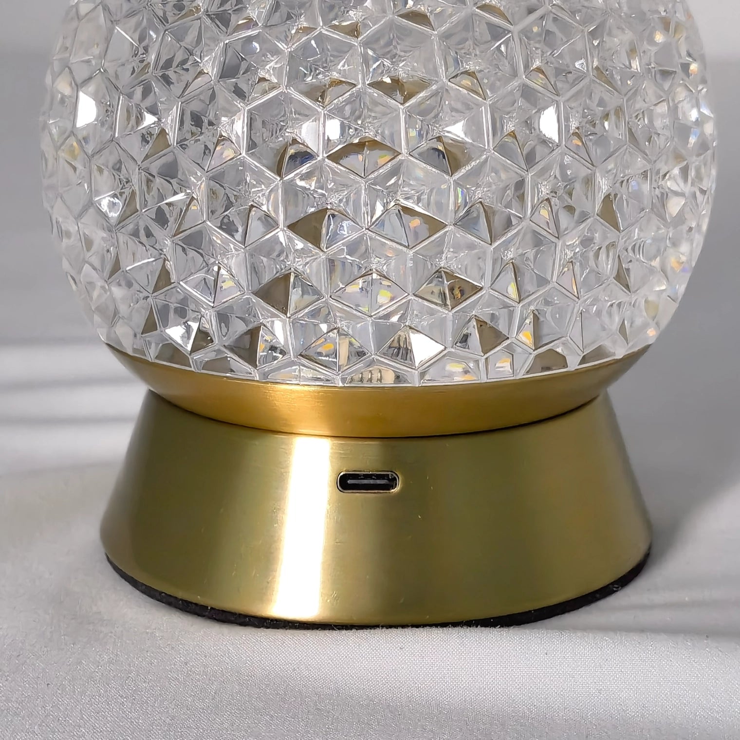 Modern cordless rechargeable LED table lamp featuring a dimmable light in a sleek nickel finish with a circular metal design.