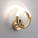 Luxurious metallic rotatable wall lamp with a circular, ring-like design, resembling elegant jewelry.