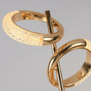 A modern wall lamp with adjustable Nordic design, featuring a rotatable body made of wood and metal in a stylish gold finish.