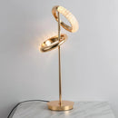 A Nordic style wall lamp with a rotatable design made of wood, metal, and glass, serving as a balance of art and function.