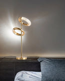 Adjustable Nordic style wall lamp with rotatable design mounted on a wall, featuring a wooden shade and a rectangular shape.