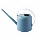Blue and white modern watering can, designed for garden use, featuring a cylindrical shape and electric blue accents.