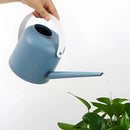 Modern and functional April Showers Garden Watering Can, featuring a vibrant electric blue color, designed for efficient watering of plants and herbs.