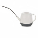 Ivory April Showers Garden Watering Can, modern and functional, displayed among various kitchen and tableware items.
