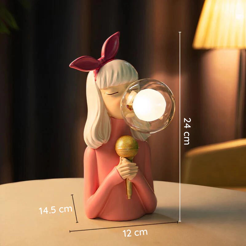 Handcrafted wooden table lamp from Artisan Sisters, designed with a whimsical, cartoon-like aesthetic featuring elements of wood and plant motifs, resembling a fictional character with long hair.