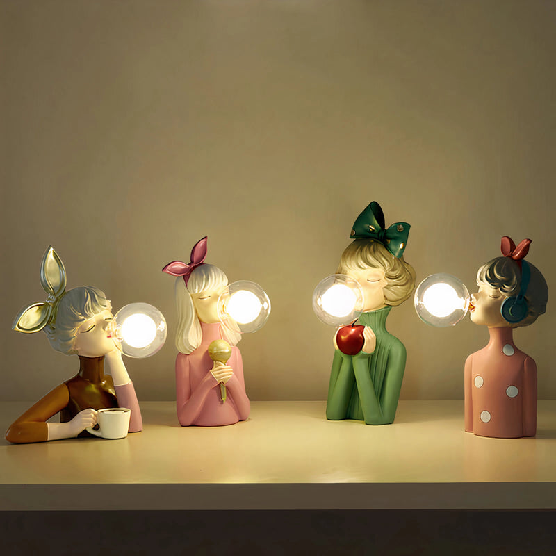 Handcrafted wooden table lamp by Artisan Sisters, creatively designed, featuring a vibrant carmine color and artistic elements in a room setting, reminiscent of still life photography.