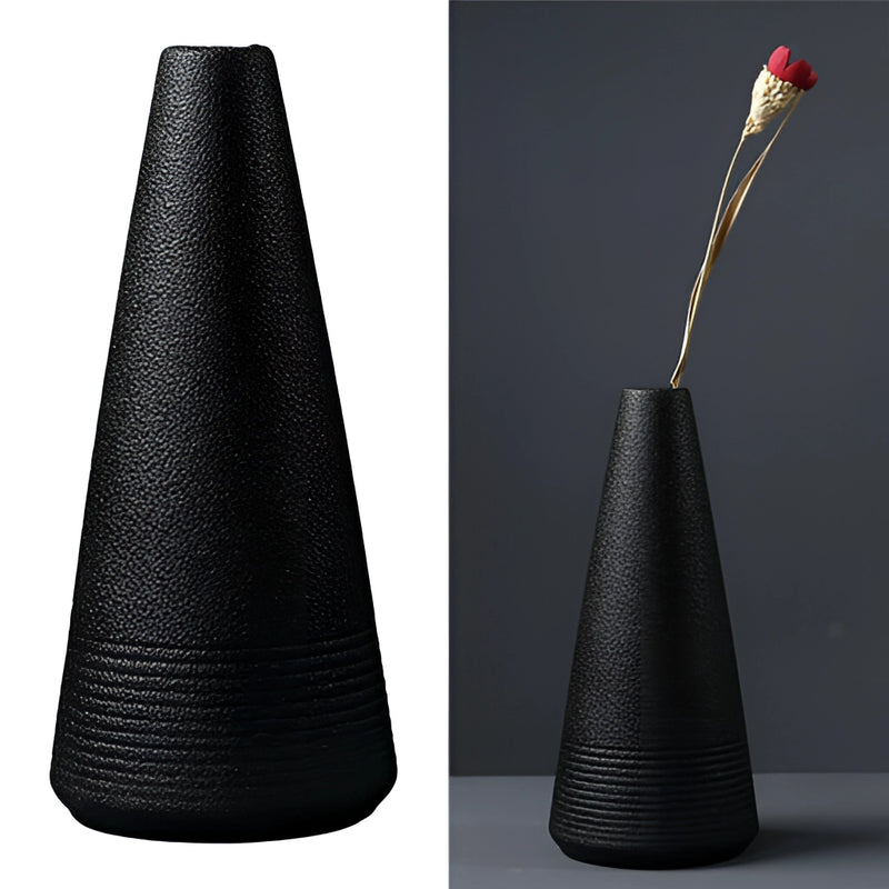 Black ceramic vase designed for home and garden use, featuring a sleek cylindrical shape with artistic still life elements.
