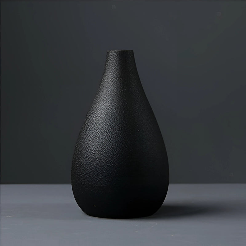 Black ceramic vase with a conical shape and wooden textured design, suitable for home and garden.