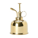 Vintage-style brass plant mist sprayer with a gold finish, featuring a cylindrical body and a circular nozzle.
