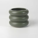 Sap Green medium-sized bubble glass planter vase with a round ceramic design, displayed on a table setting.