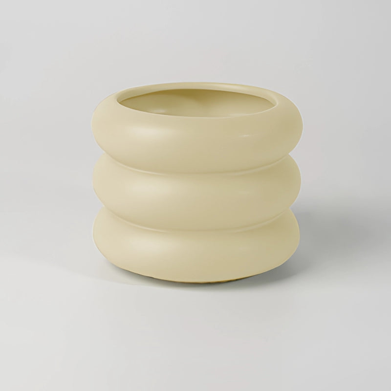 Medium-sized beige ceramic bubble glass planter vase in a round, egg-shaped design, suitable for display as dishware or serveware.
