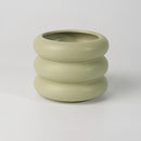 Light green medium-sized ceramic round bubble glass planter vase featuring a pottery and porcelain design, displayed as dishware.