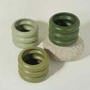 Bubble glass planter vase with a ceramic round design, styled with a circular shape resembling a camera lens.
