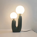 Cactus design table lamp featuring milk glass globes and LED lights, with a wooden base and artistic tints and shades, shaped in circles.