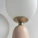 Cactus design table lamp featuring milk glass globes and LED bulbs, with a beige metal base and circular light fixtures attached to the ceiling.