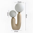 Cactus design table lamp featuring milk glass globes and LED lights, in the Rosa color variant with cold white illumination.