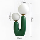 Cactus design table lamp featuring milk glass globes and LED bulbs, in green with cold white light.