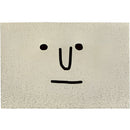 Large indoor-outdoor rug featuring a cartoon design of a smiling face with big eyes and a prominent nose, styled with artistic symbols and a circular motif on a rectangular background.