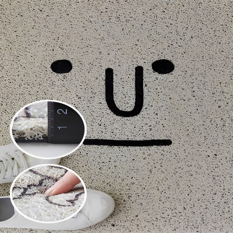Colorful cartoon design indoor outdoor rug featuring a playful pattern of large, happy eyes on a textured surface.