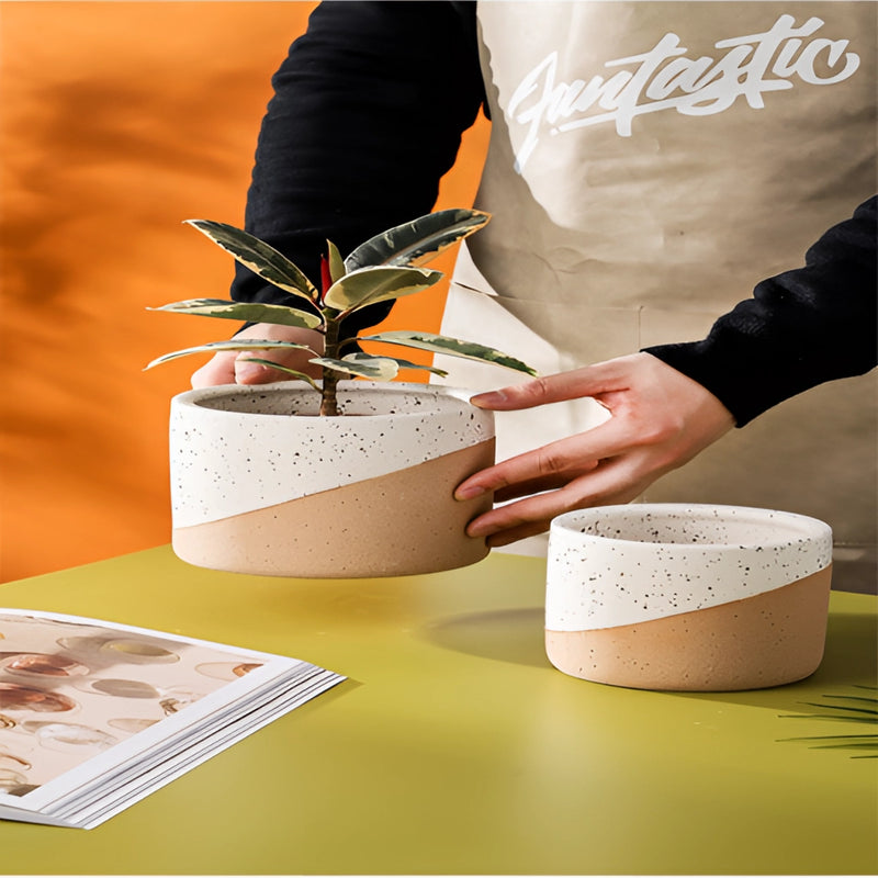 Ceramic flowerpot in linen color available in small, medium, and large sizes displayed on a table.