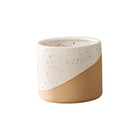 Medium-sized ceramic flowerpot in a linen color, designed in a cylindrical pottery style.