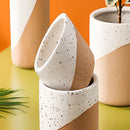 Ceramic flowerpot wrapped in linen textile available in small, medium, and large sizes.