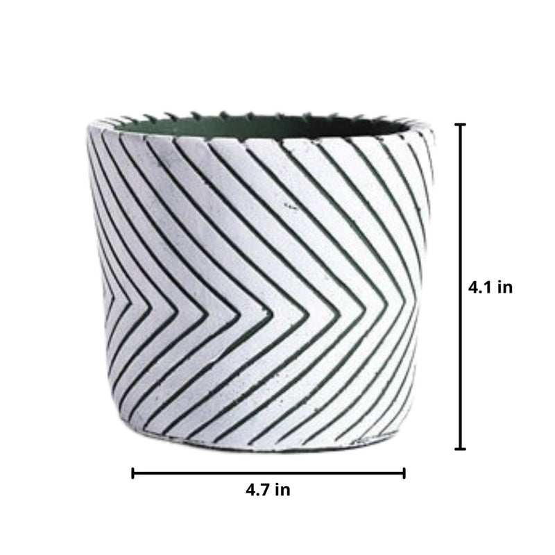 White ceramic hand-painted planter with textured designs featuring line art and patterns in magenta and electric blue.