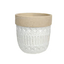 Ceramic plant pot inspired by Phi Phi Island, featuring a cylindrical shape with artistic patterns and a mix of wooden, metal, and concrete textures on a floor setting.