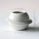 Ceramic plant pot with astral galaxy design, featuring a rounded shape and detailed celestial patterns.