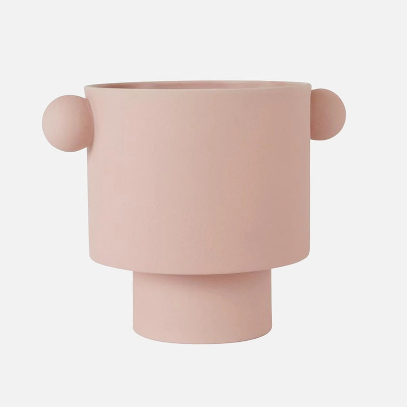 Large rosewater-colored ceramic vase in Scandinavian design with earthy tones, displayed on a wooden surface.
