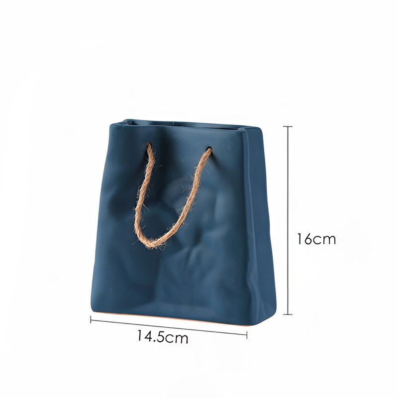 Dark blue ceramic vase with a unique shopping basket design, resembling a denim texture and electric blue color.