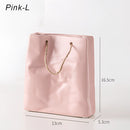 Pink ceramic vase with a large shopping basket design, featuring magenta patterns and metallic accents.