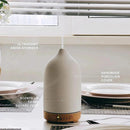 Ceramic aromatherapy diffuser with wood grain design and 7-color night light feature.