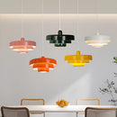 Modern Circle Design Pendant Lamp featuring linked metal circles, displayed in an interior setting with white, green, orange, and yellow accents.