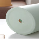 Colorful ceramic planter with matching saucer set displayed on a table.