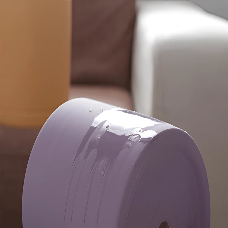 Colorful ceramic planter and saucer set in magenta and electric blue, featuring a cylindrical shape with a glossy finish.