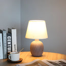 Contemporary rechargeable table lamp featuring a unique style, placed on a wooden table within an elegantly designed interior.