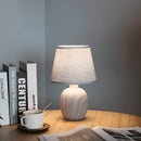 Contemporary rechargeable table lamp with a unique style, featuring a grey lamp on a hardwood table, set against a stylish interior design backdrop.