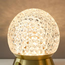 Modern design cordless rechargeable table lamp LED dimmable light featuring an artistic lampshade, circular elements, and wooden accents.