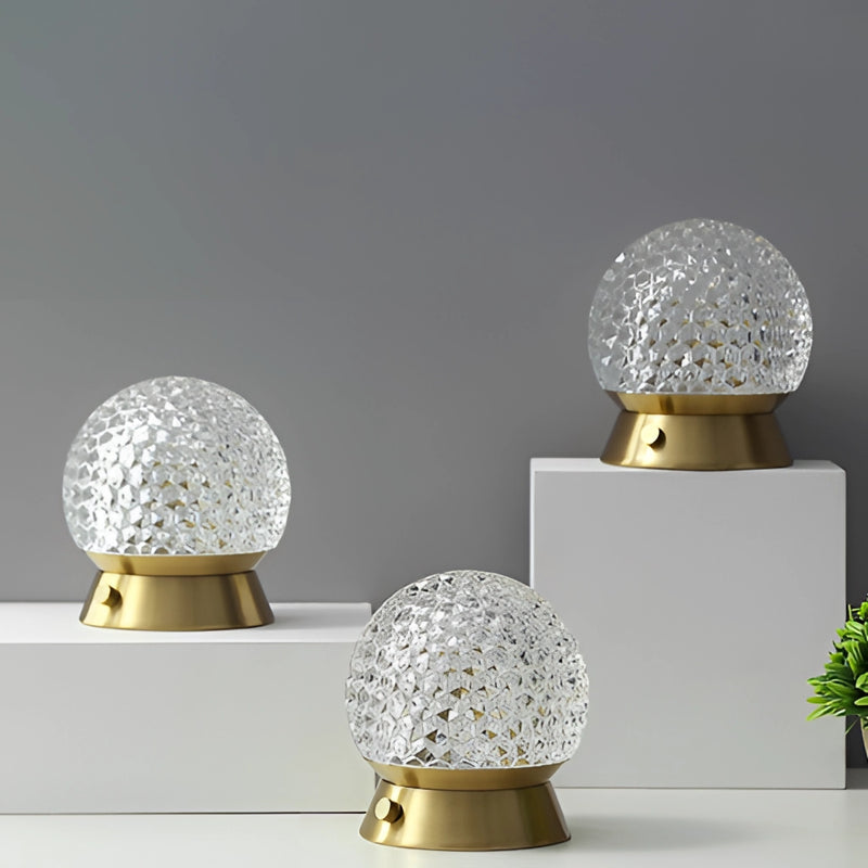 Modern design cordless rechargeable table lamp LED dimmable light, featuring yellow and silver colors, accompanied by plant decoration.