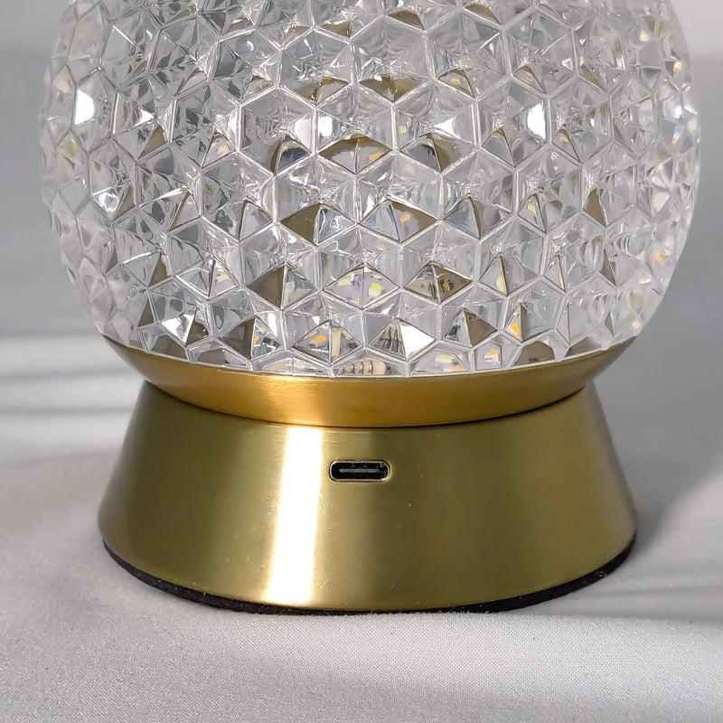 Modern cordless rechargeable LED table lamp featuring a dimmable light in a sleek nickel finish with a circular metal design.