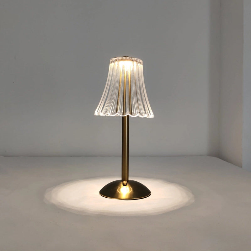 Cordless table lamp featuring a durable design with a wooden base, glass lampshade, and subtle tints and shades, enhancing both art and functionality.