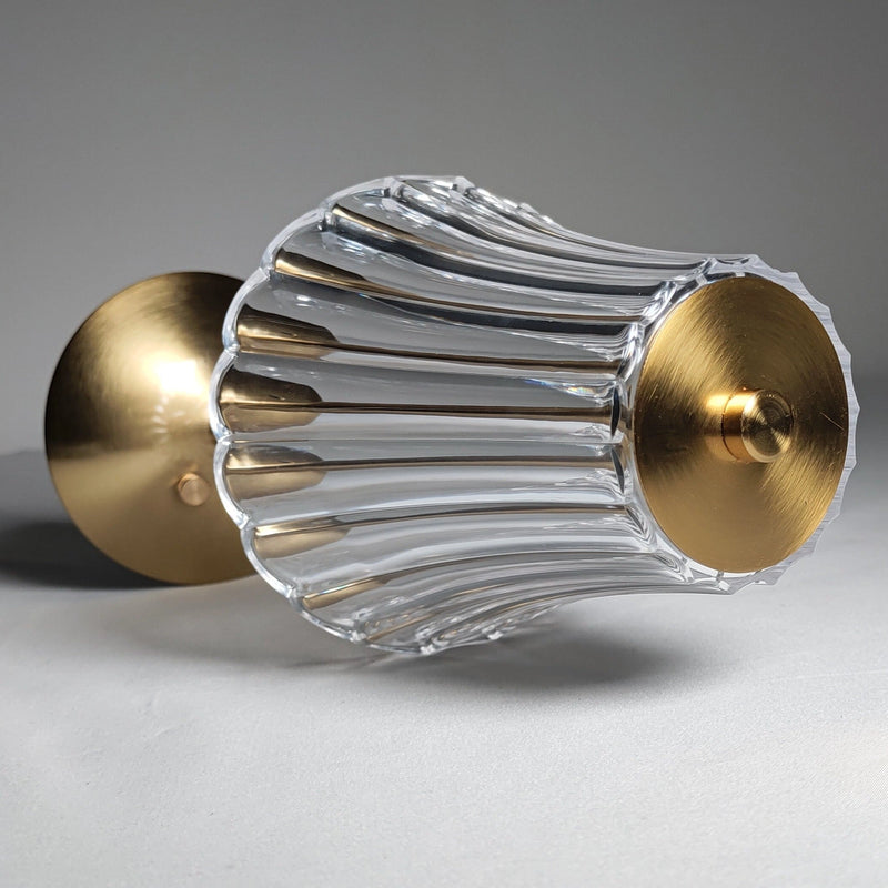 Cordless table lamp featuring a durable metal body with a nickel finish and cylinder shape, designed to resemble a piece of art or a fashion accessory.