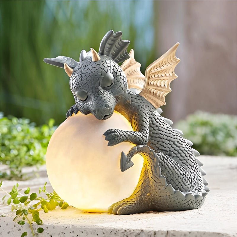 Dragon shaped LED table lamp designed as a cozy dragon, featuring wings and resembling a mythical creature sculpture amidst plants.