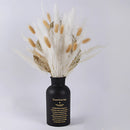 A set of 30 dried pampas grass flowers displayed in a glass vase, ideal for interior decoration.