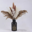 30-piece dried pampas grass flowers set displayed in a vase, featuring a mix of twigs and natural grass materials, ideal for interior decoration.