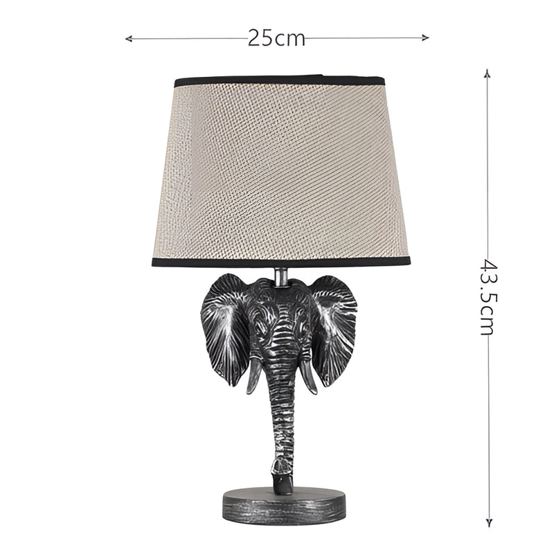 Rechargeable elephant design lamp featuring a patterned sleeve and electric blue accents, set against a backdrop with plants.