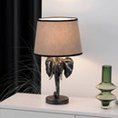 Rechargeable Elephant Design Lamp placed on a table, showcasing artistic lines, shades, and a stylish lampshade in a tastefully decorated interior.