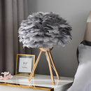 Gray Feather LED Table Lamp with dimmable lighting, featuring a rectangular base and twig-inspired design elements, set in an interior environment.